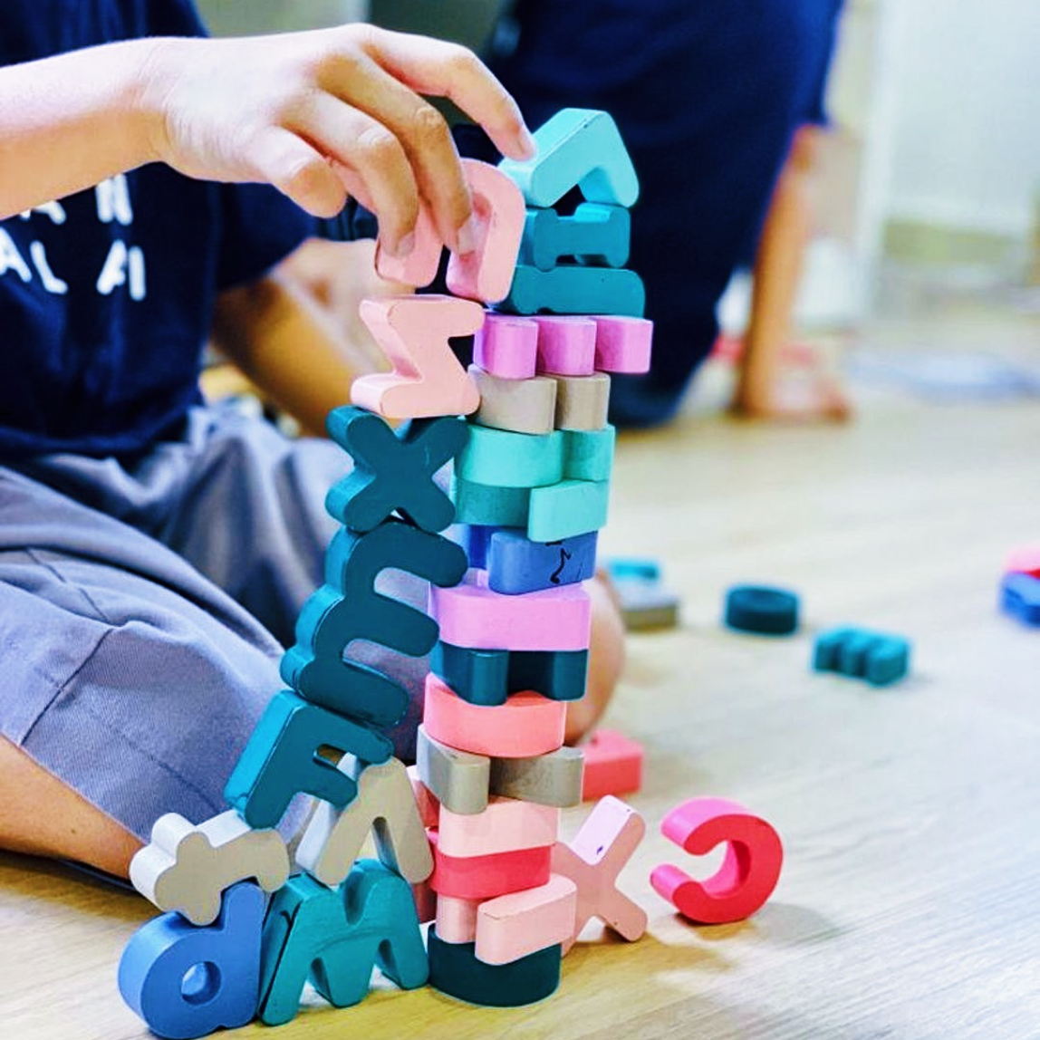a child arranging blocks